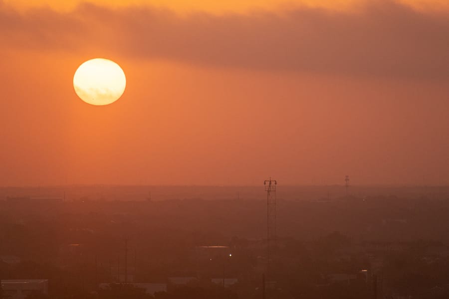 The Sun rises over Austin, Texas, USA during a dangerous Summer heat wave that has been straining the power grid and causing brownouts